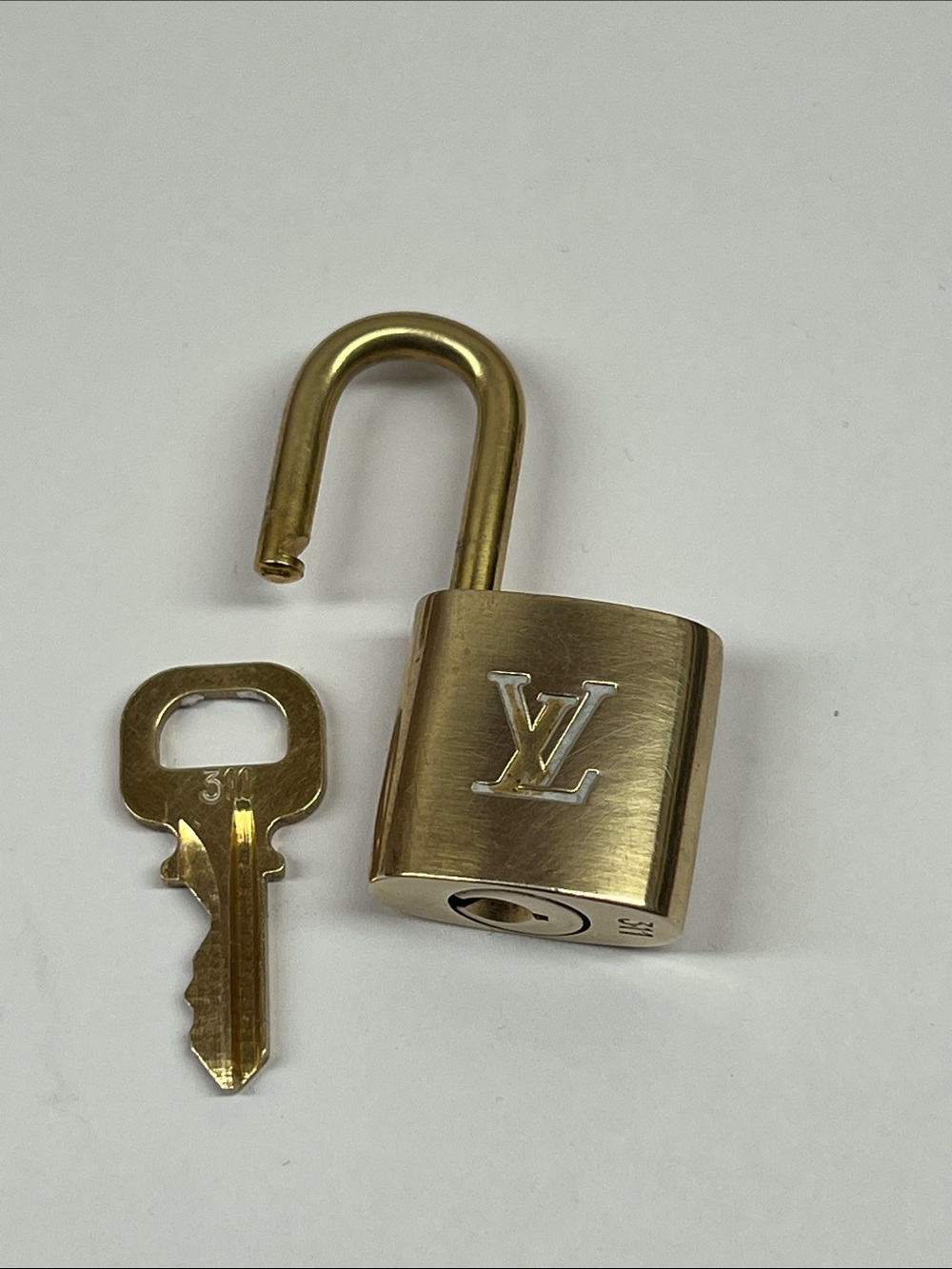 Polished #311 Louis Vuitton Gold-Tone Padlock and Key Set